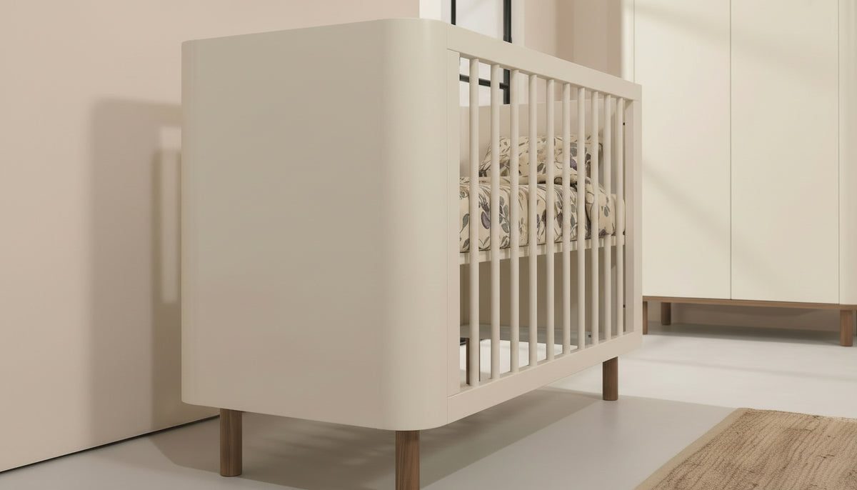 Kenva Cot — side detail in a nursery