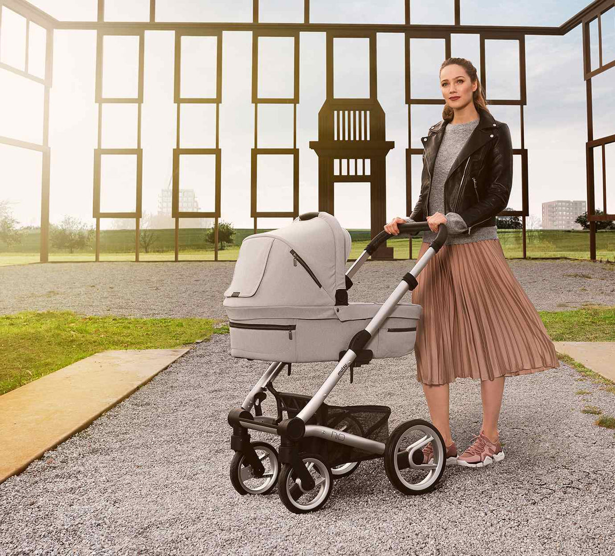 Mother out walking with a Mutsy pram